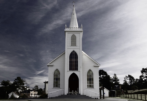 A recreation of the Ansel Adams photo of the St. Teresa of Avila Church in Bodega Bay, but with Summer and Josie at the doorstep