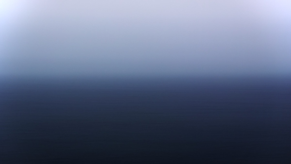 A moody long exposure of the ocean taken from a beach just north of Monterey, California
